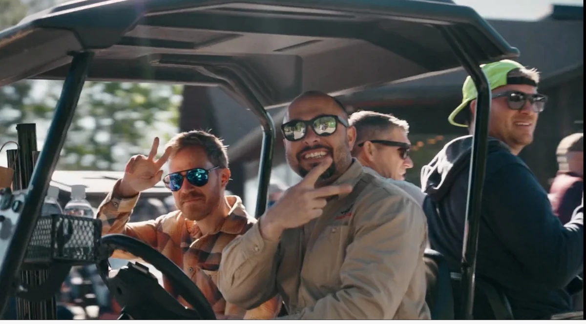 Guests enjoying their outing together in a golf cart